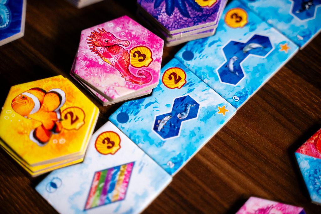 Aqua coral reef tiles and animals during play
