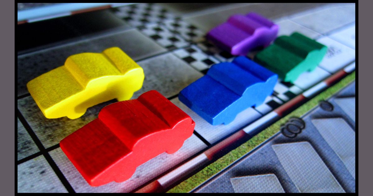 Automobiles cars grouped together during a race