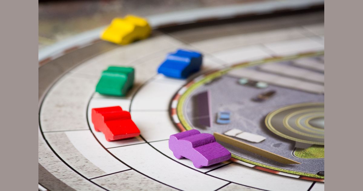 Automobiles race cars competing through a corner