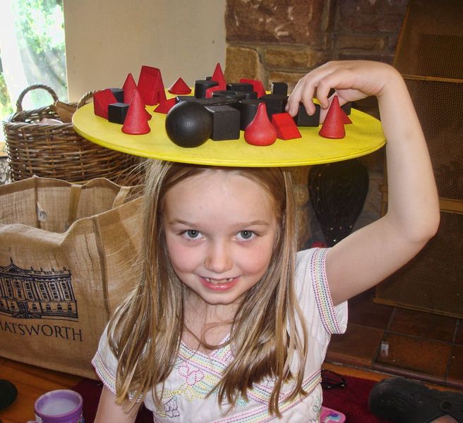 Bamboleo plate balanced with many wooden pieces