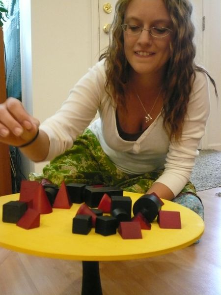 Bamboleo wooden shapes on the balancing plate
