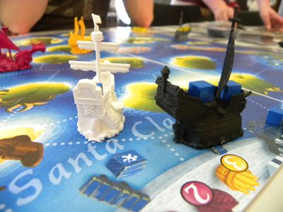 Black Fleet miniature ships and cargo cubes close up