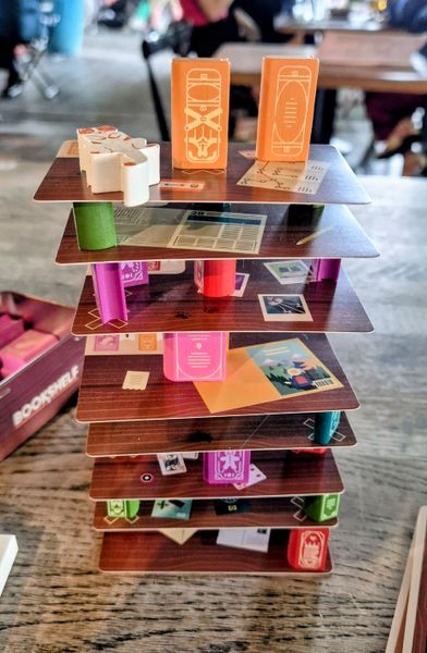 Bookshelf game with wooden books stacked high
