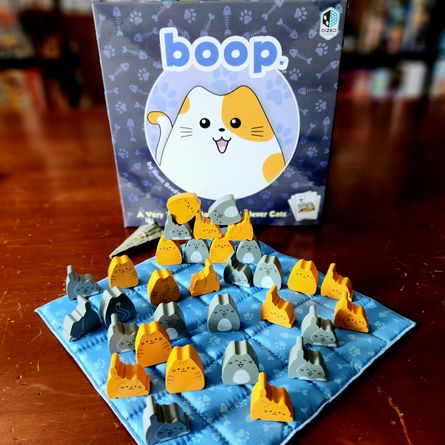 boop quilted game board with cat pieces during play