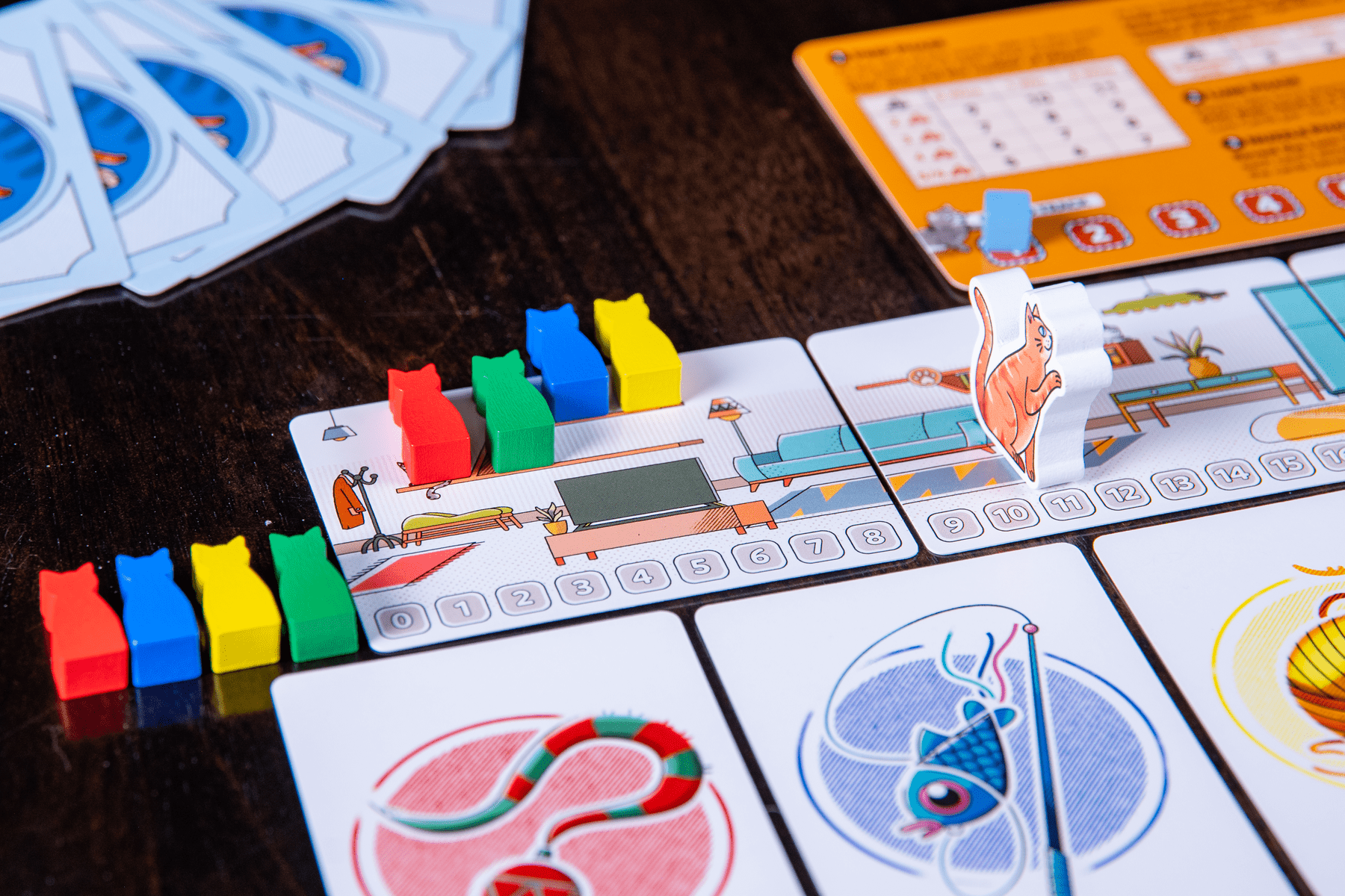 Cat Between Us cards arranged during play
