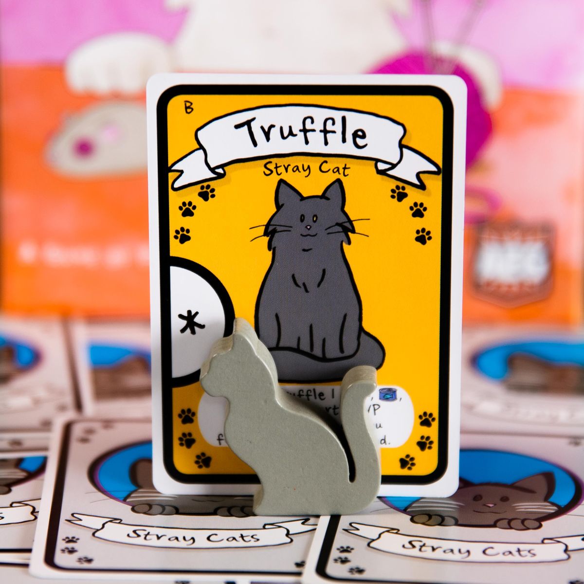 Cat Lady cards and food cubes arranged during a game