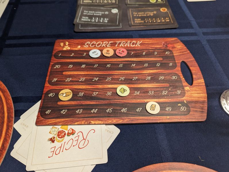 Charcuterie board game six-player table setup