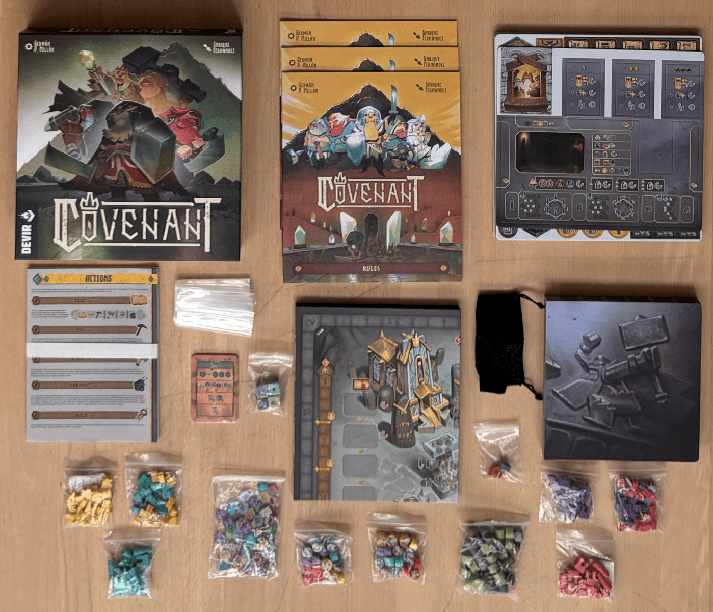 Covenant board game components arranged around the box
