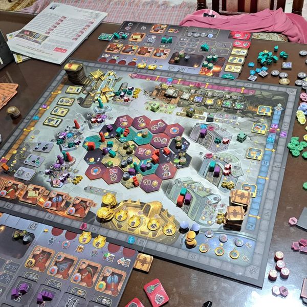 Covenant board game mountain and player boards during play