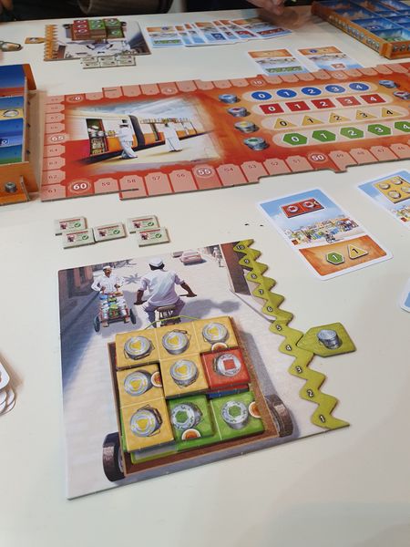 Dabba Walla player board and stacked tiles