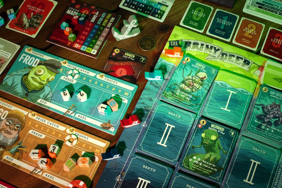Deep Regrets game setup with tackle dice and fish cards