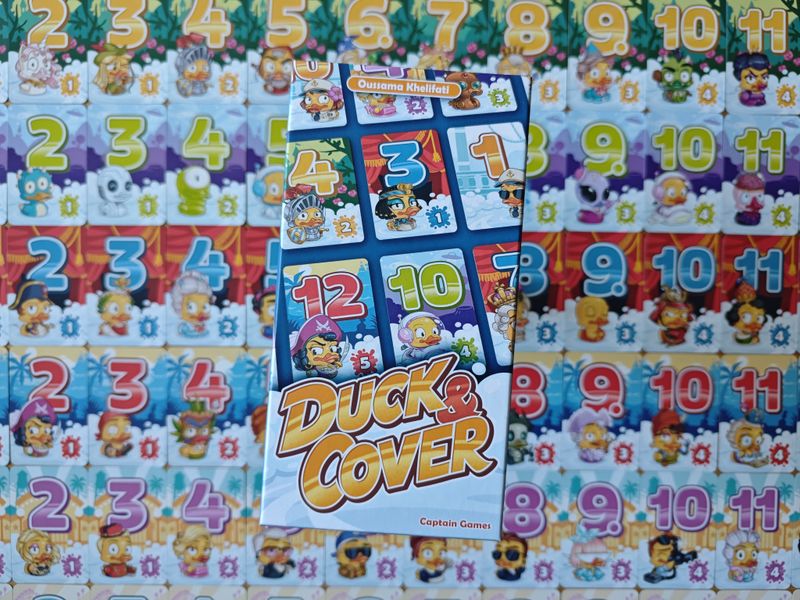 Multiple Duck and Cover player grids on a table