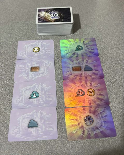 Falling board game victory point cards