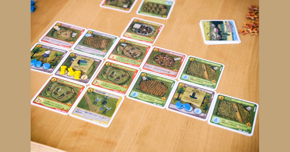 Fields of Green cards arranged as a farm during play