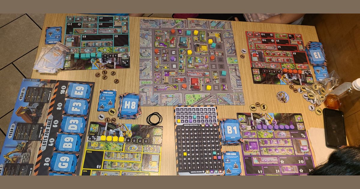 Foundations of Metropolis game in progress with deeds and coins