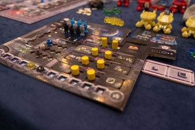 A player area in From the Moon with board cards and resources