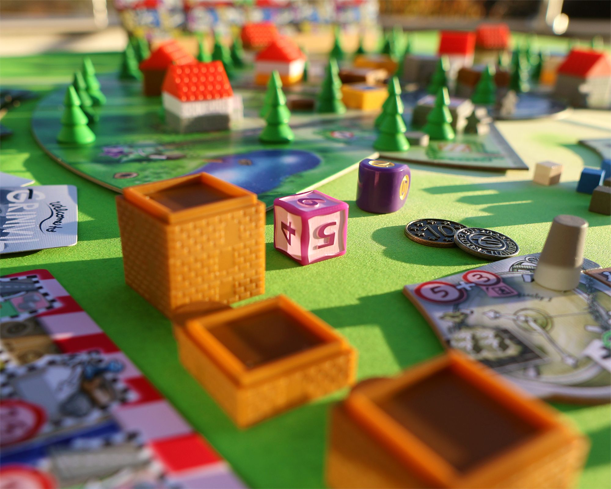 Grinivil preproduction city layout and game components
