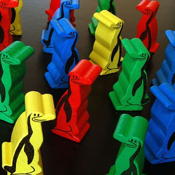 Close-up of Hey, That’s My Fish penguin playing pieces
