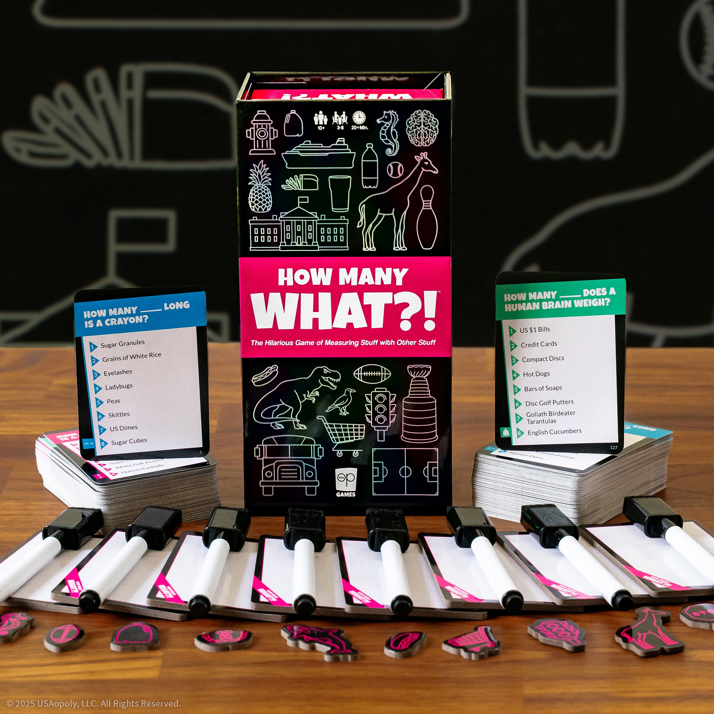 How Many What?! components arranged around the box and scoreboard