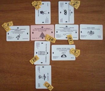 Illuminati cards arranged in power structures during play