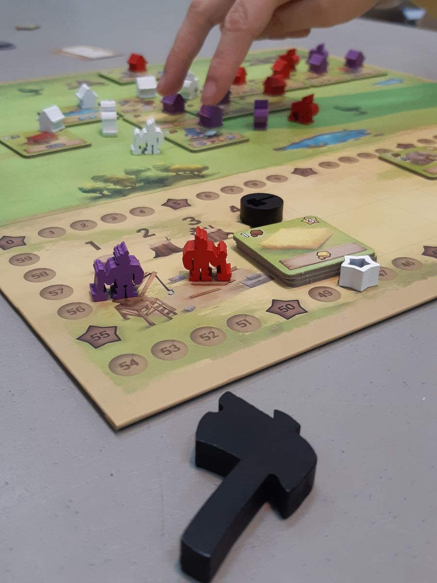 Three player Little Town game in progress on a shared board