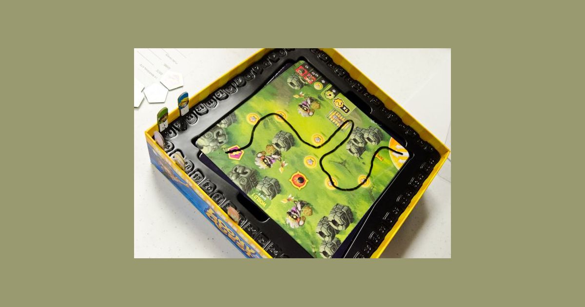 Loony Quest multiplayer game and components on a table