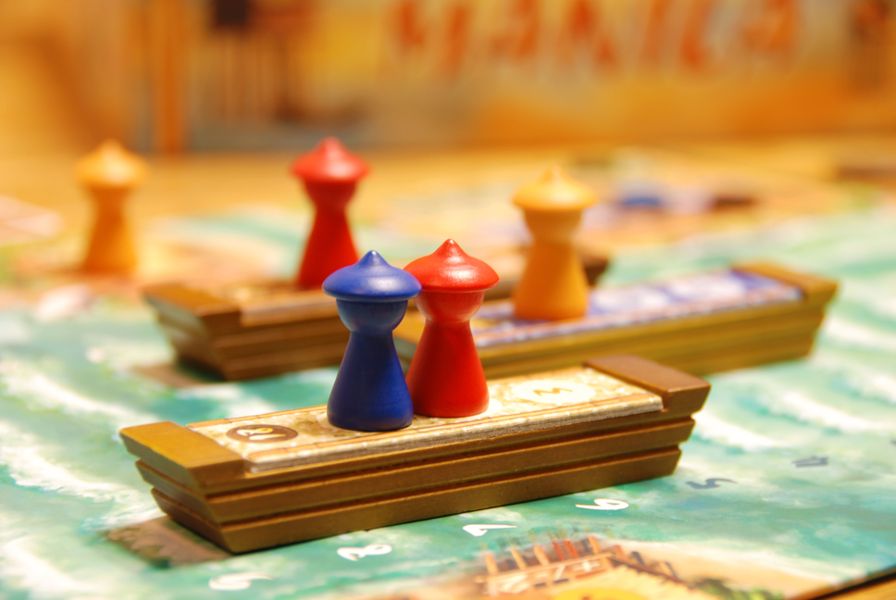 Manila cargo boat and accomplice pieces on the game board