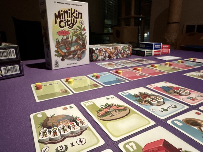Minikin City cards beside the game box