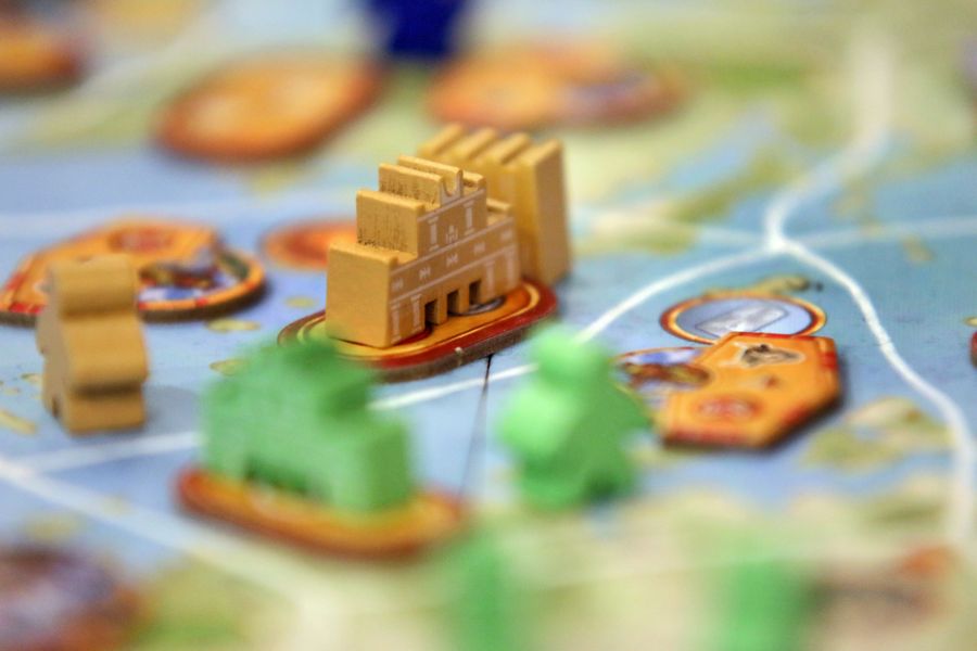 Minos game with developed cities routes and player tableau