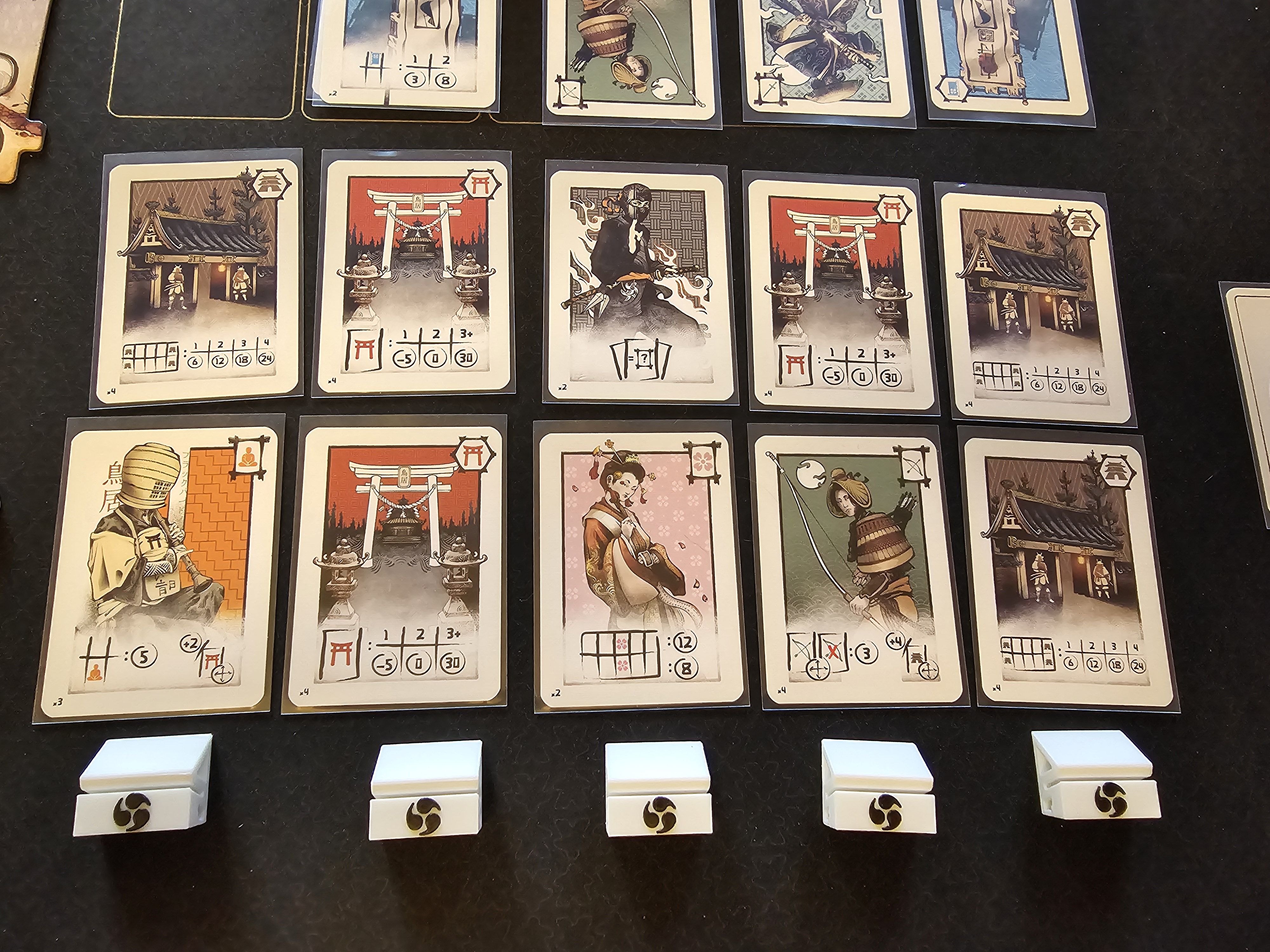 Naishi cards and court board during play