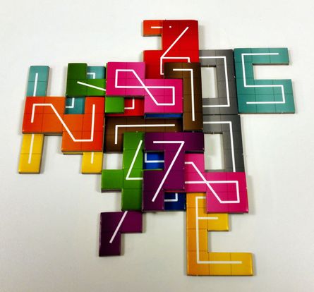 Colorful NMBR 9 number tiles stacked in layers