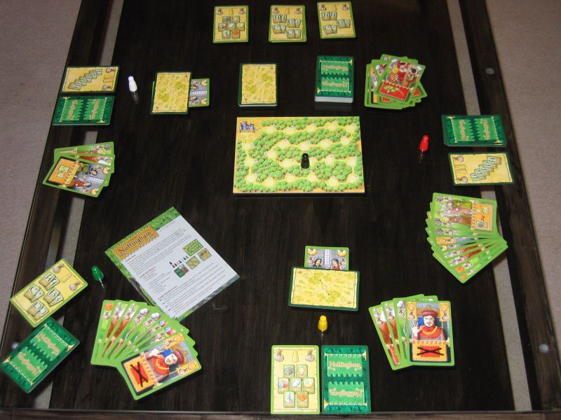 Nottingham players revealing cards around the table