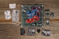 Pacts board game components laid out
