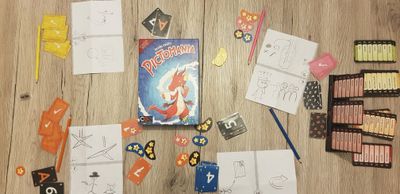 Four people playing Pictomania Second Edition