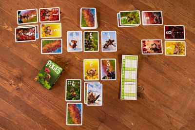 Pixies cards arranged in a three by three player tableau