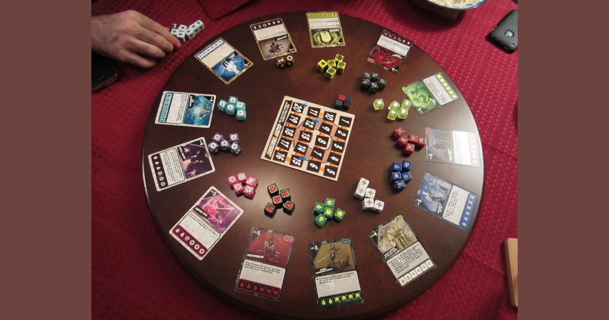 Quarriors custom dice arranged in a circular display
