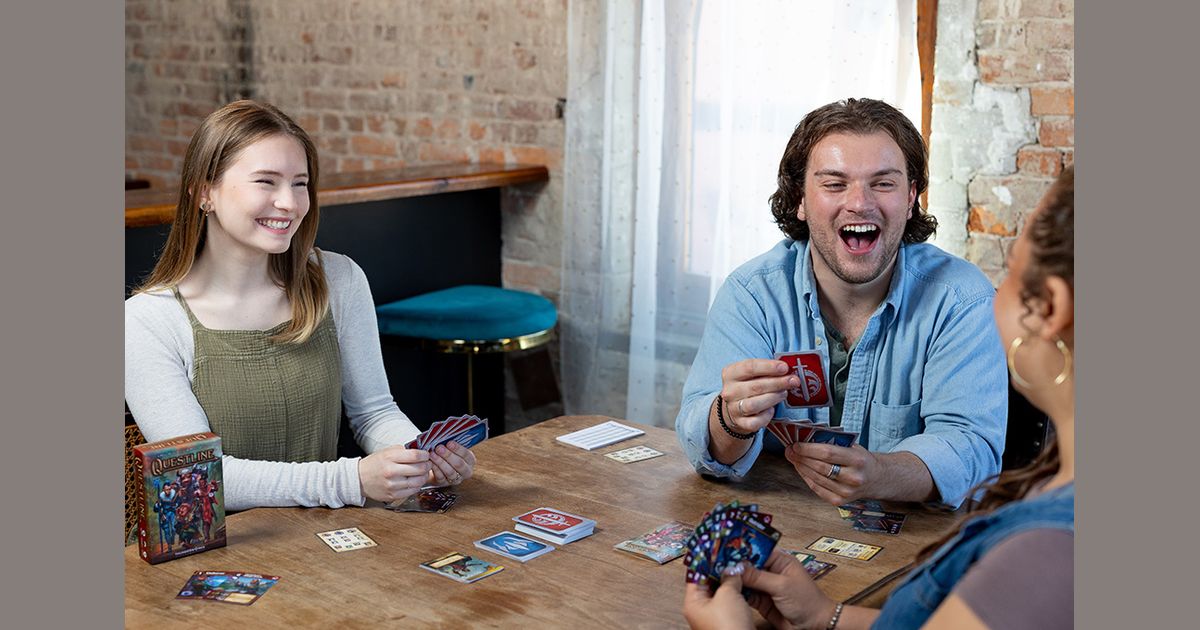 A group playing Questline around a table