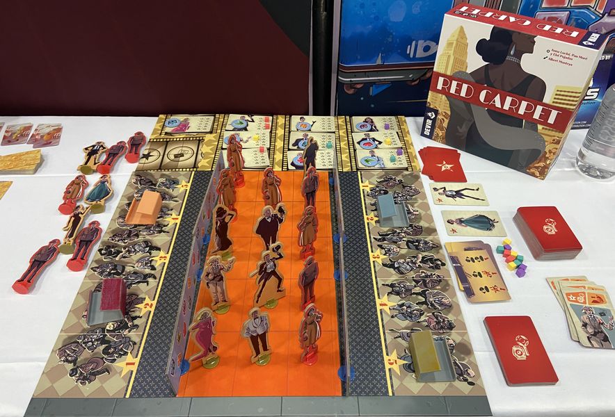 Red Carpet board game set up with smartphone pedestal