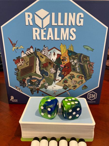 Two custom dice from Rolling Realms