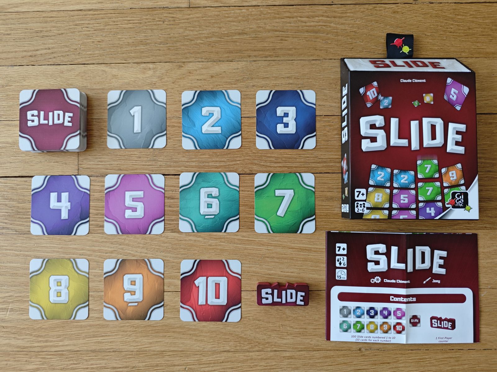 Slide number cards and first-player marker