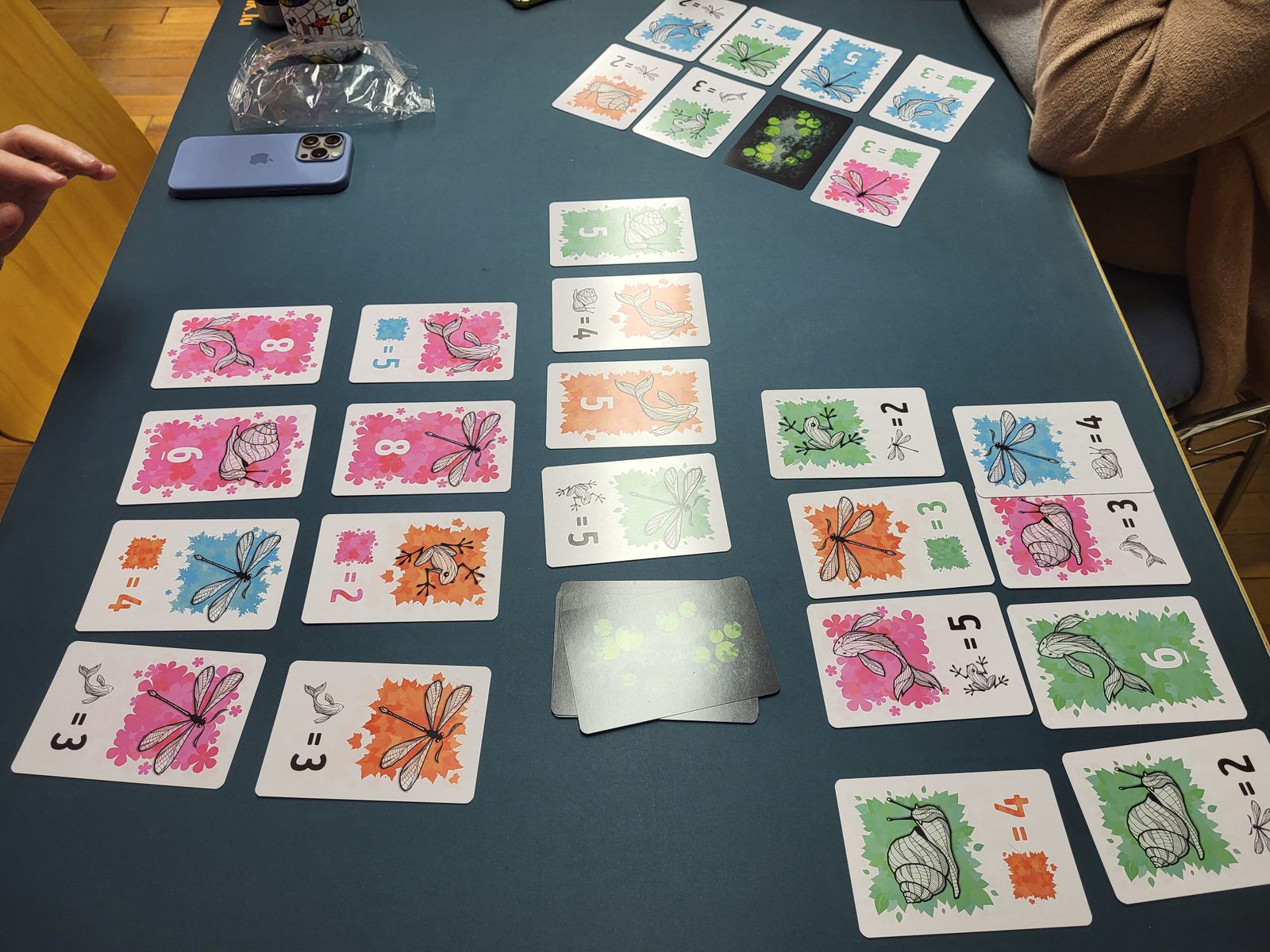 Symbiosis card game during play
