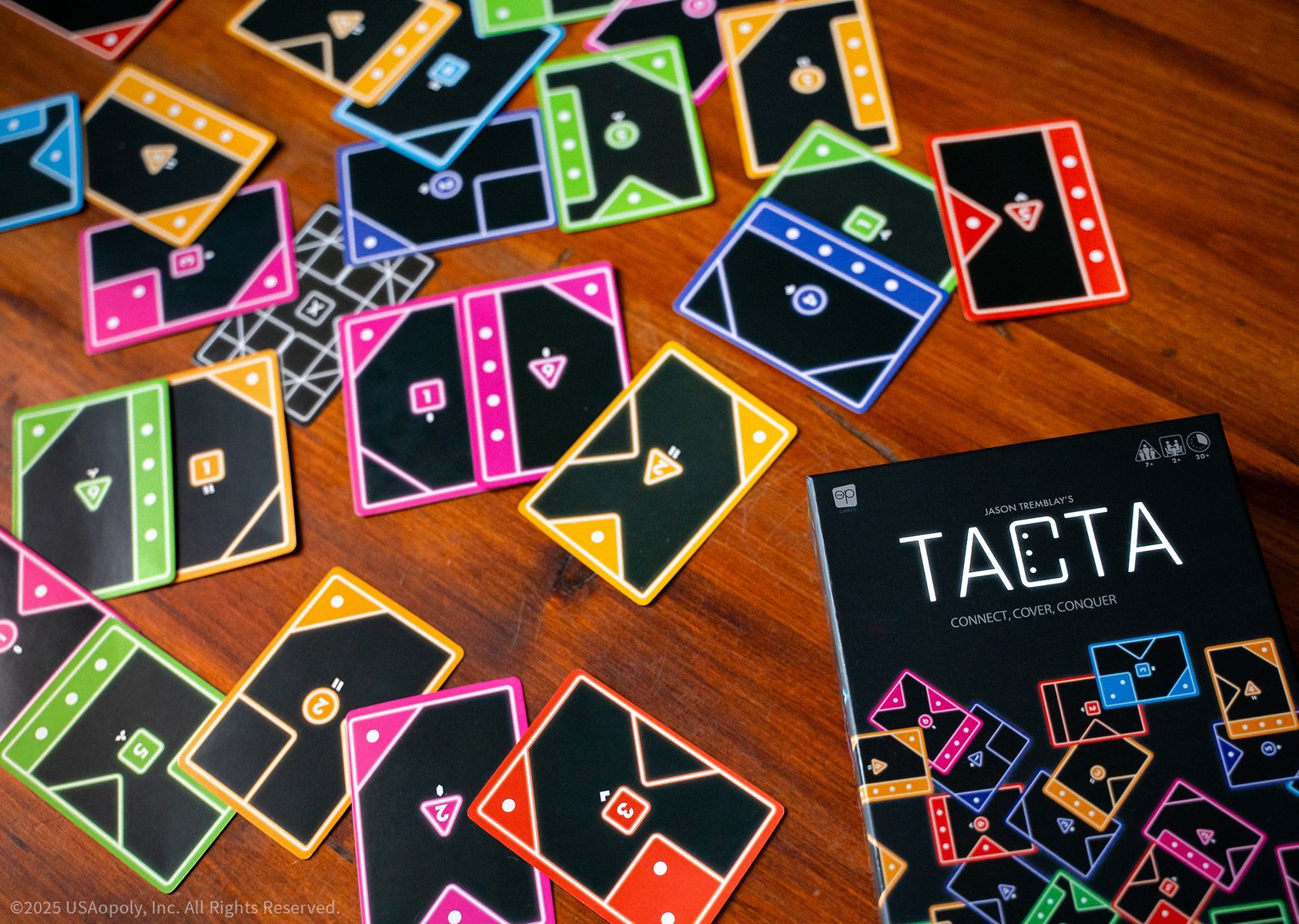 Players arranging Tacta cards on a table