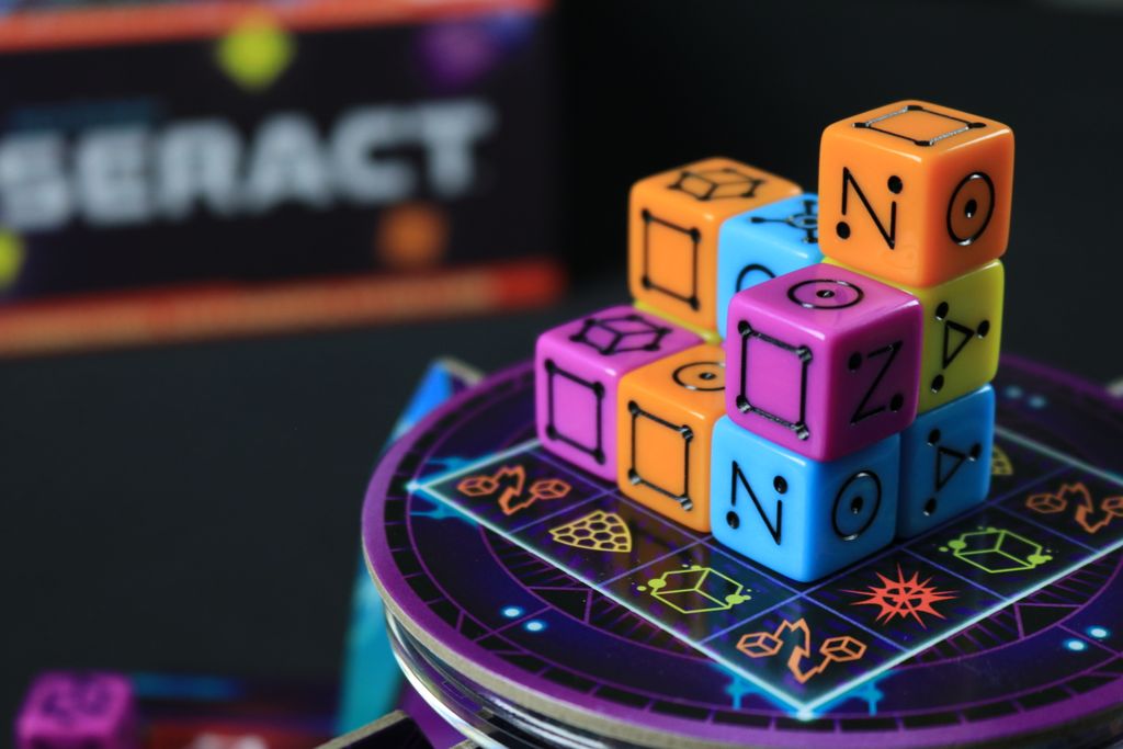 Tesseract dice cube with event symbols revealed