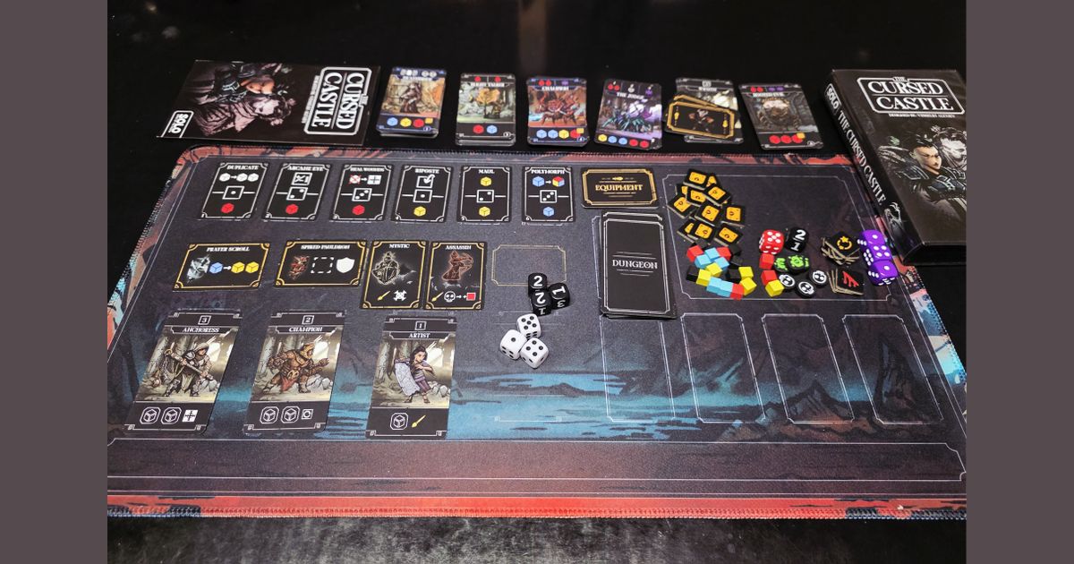 The Cursed Castle game setup with dungeon cards and mat