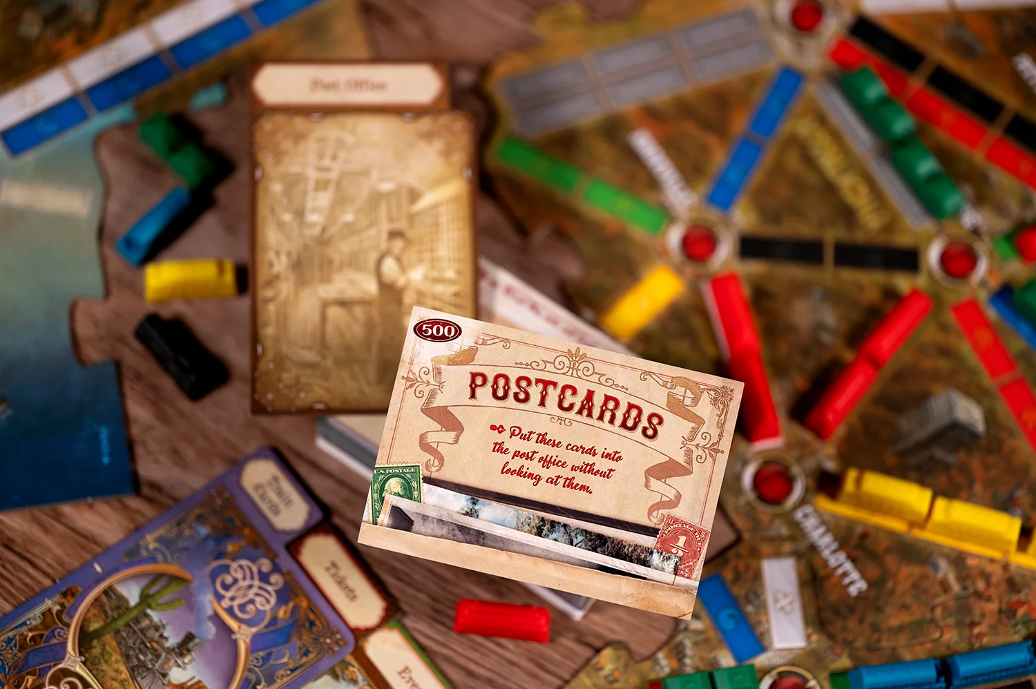Plastic trains and ticket cards from Ticket to Ride Legacy