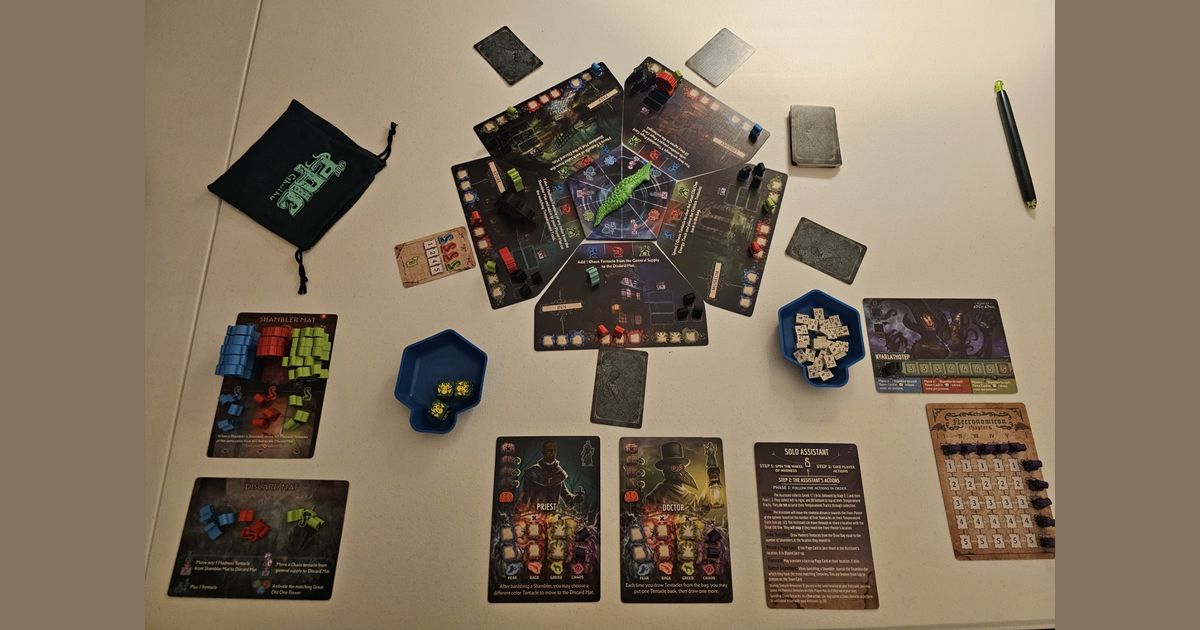 Tiny Epic Cthulhu set up on a table