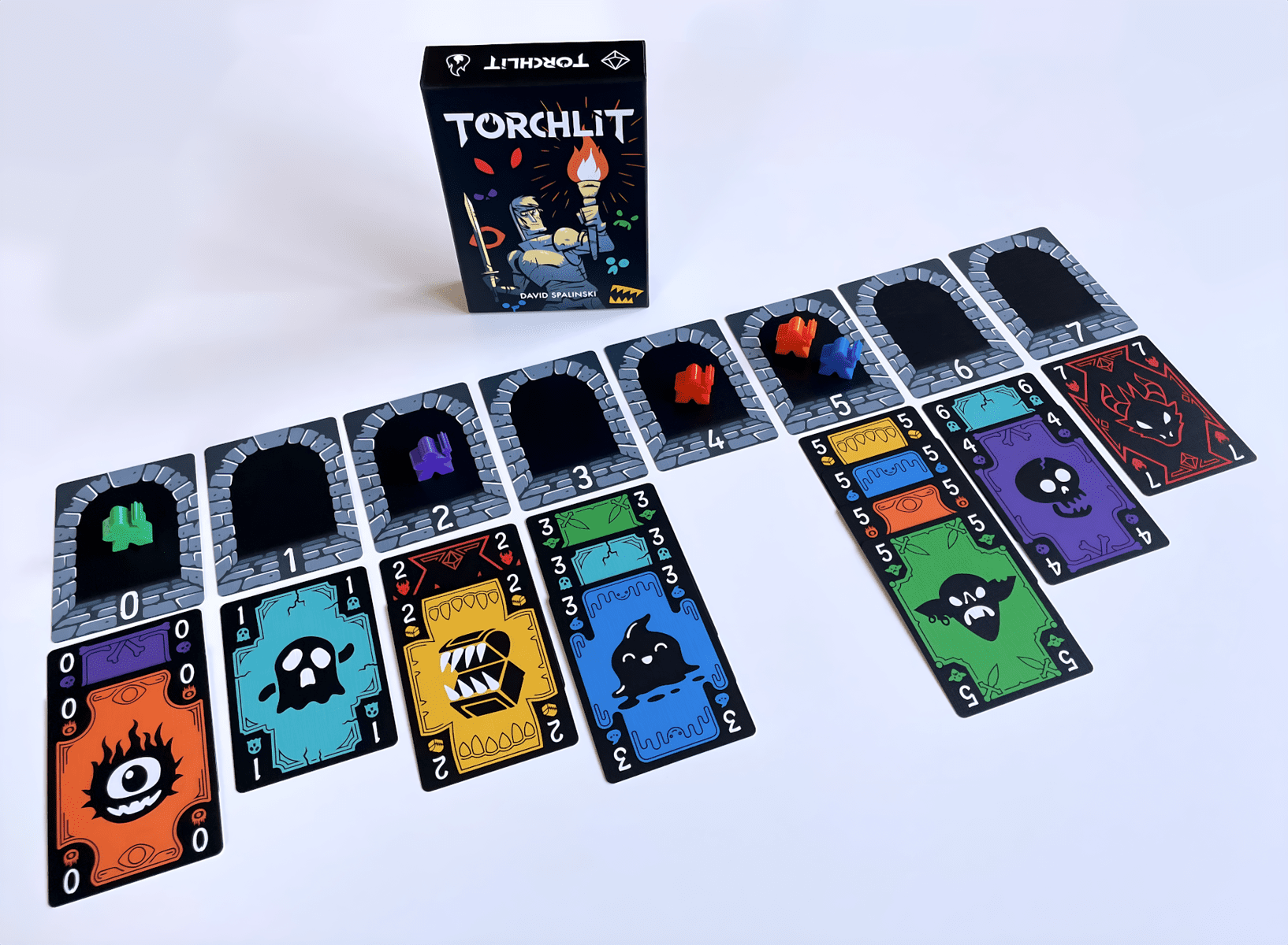 Torchlit cards arranged for play