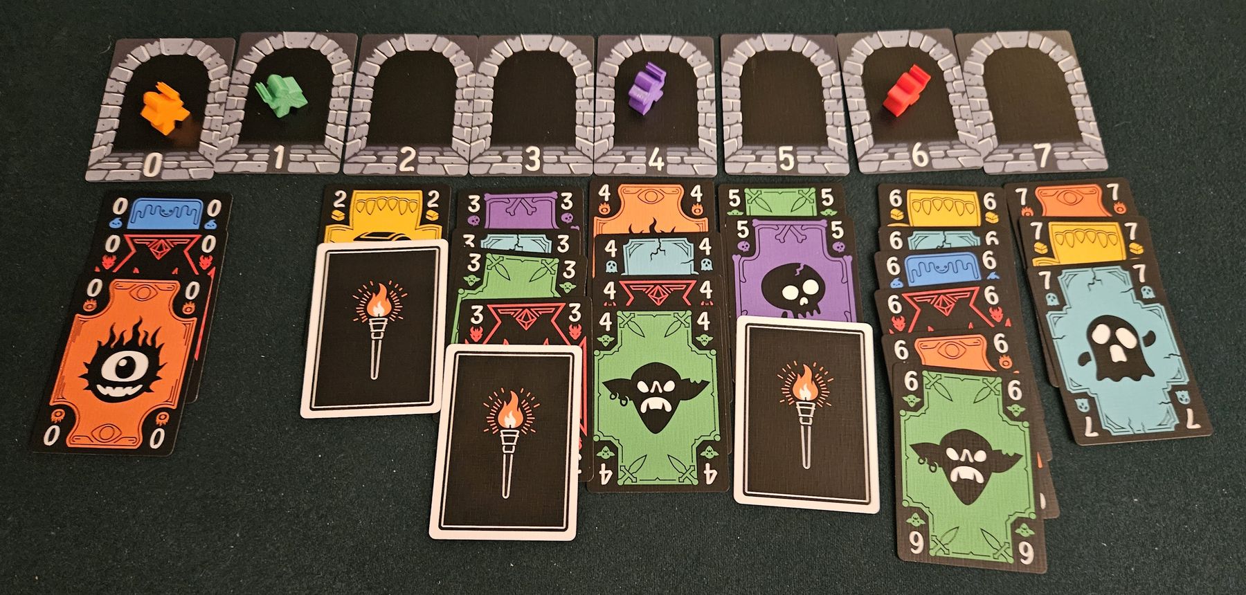 Torchlit trick-taking game in progress