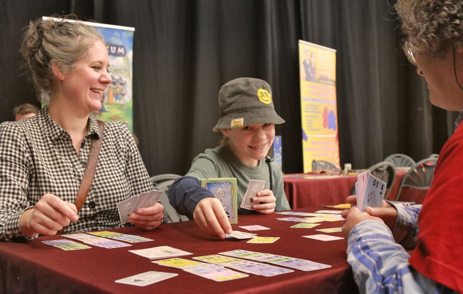 Up or Down card game set up at a festival table