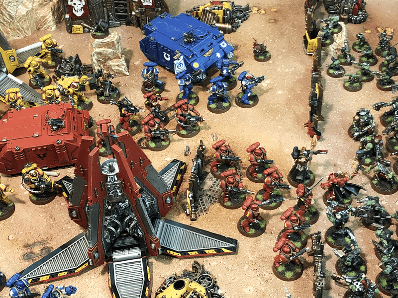 Warhammer 40000 miniature armies on a battlefield